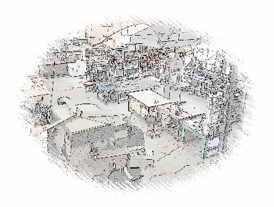 加工設備と作業台が並び複数の工程が見渡せる工場風景